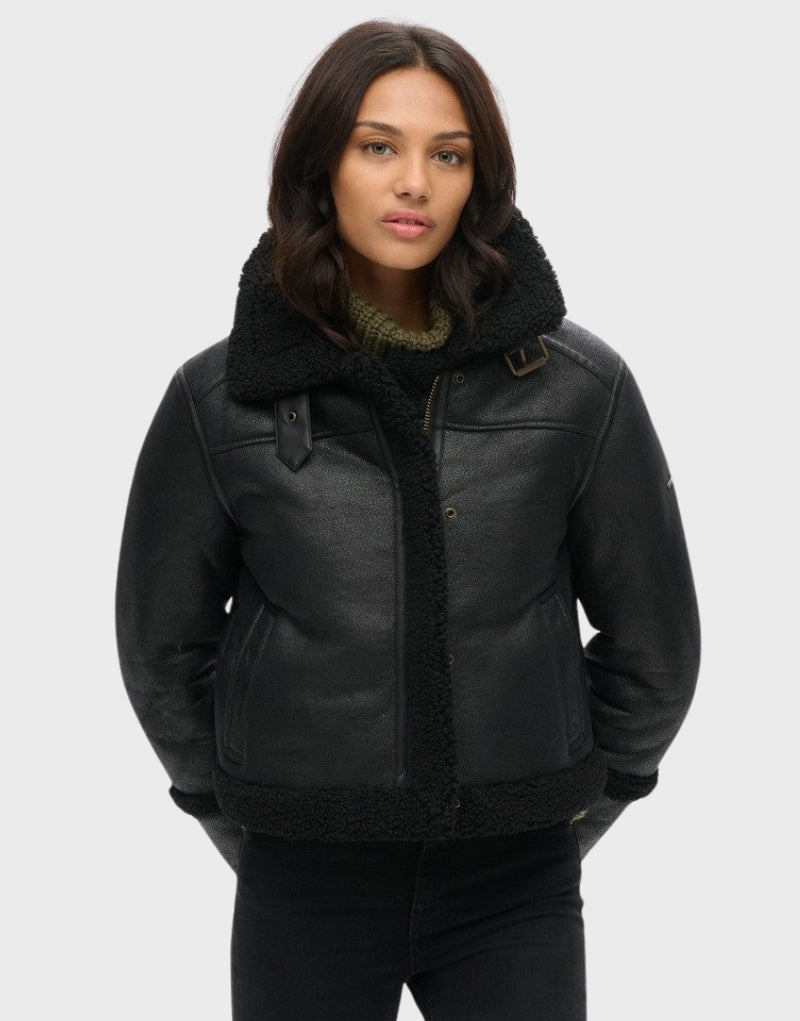 Front view of a black leather shearling aviator jacket with a fur-lined collar and cuffs, offering a stylish and cozy winter look.