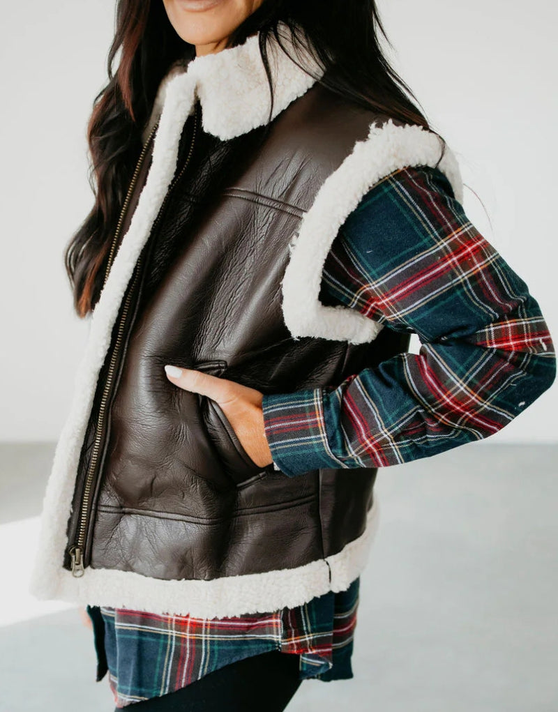 Side profile of Ruby Brown Sheepskin Shearling Vest - Women's Sleeveless Leather Vest with Shearling Lining and Side Pockets.