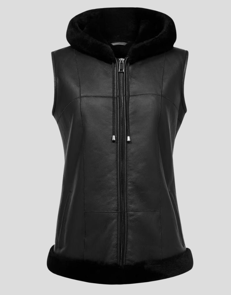 Front view of a black sheepskin and shearling vest with a hood.