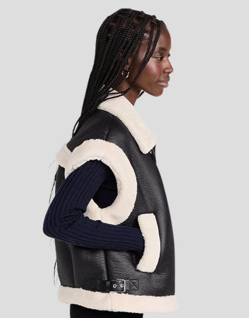 Side profile of Emily Black Shearling Vest - Faux Shearling Lined Women's Leather Vest with Side Pockets and Buckle Straps.