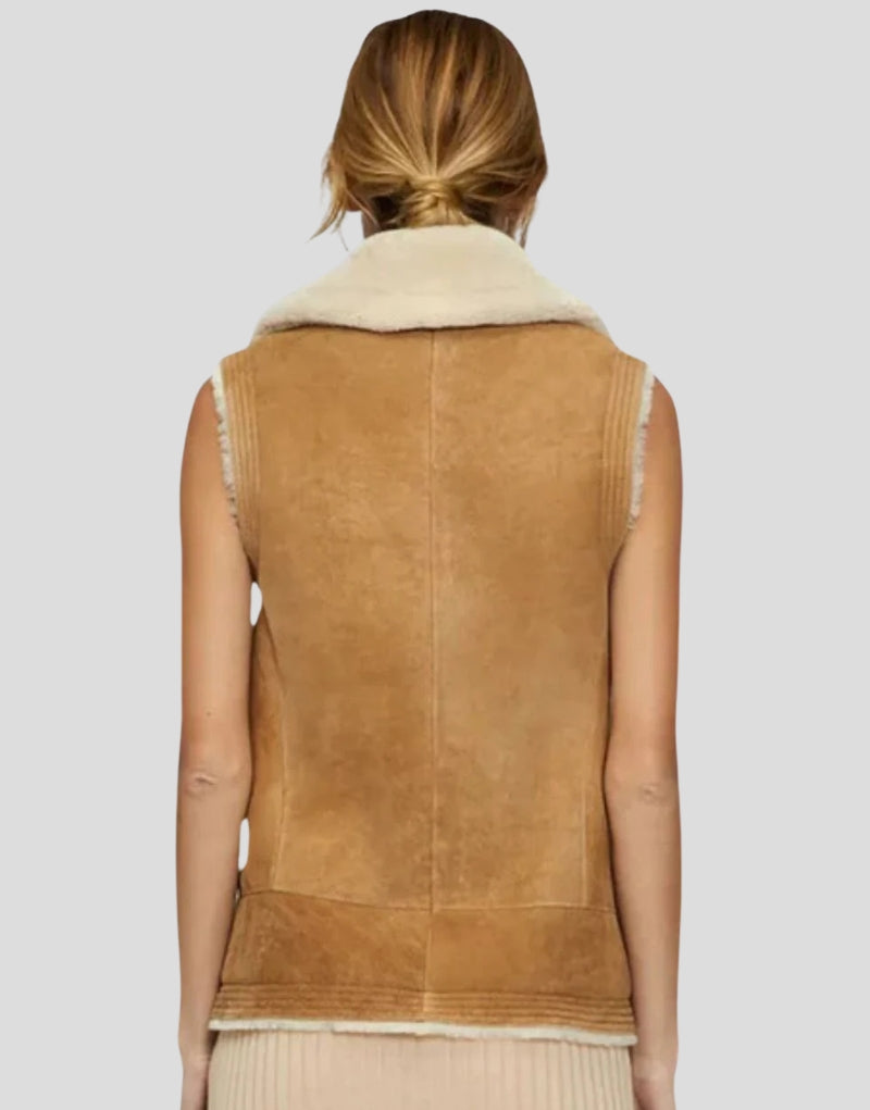 Back view of Leah Stylish Sheepskin Vest - Women's Tan Leather Vest with Soft Faux Shearling Trim and Sleek Fit.